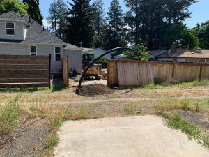 Backyard sewer repair utilizing pipe bursting method.