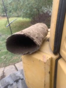 Elongated Orangeburg pipe section shows what can happen when the forces of earth above collapse the pipes leading to failure.